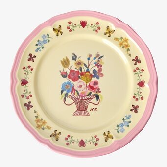 Bild av assiett med vågig kant och färgglad blomsterdekor