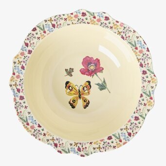 Bild av dekorativ skål med fjäril och blommor i pastellfärger