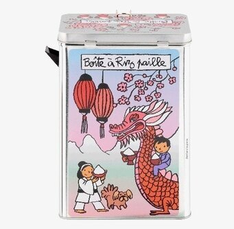 Bild av färgglad plåtburk med asiatisk drake och rislampor