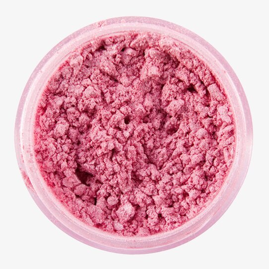 Bild av rosa pulver i burk med skimrande partiklar