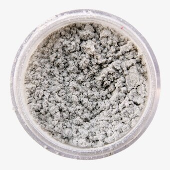 Bild av skimrande silverpulver i genomskinlig burk