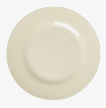 Foto: Rund gräddvit tallrik på vit bakgrund ovanifrån