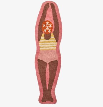 Foto: Rosa tuftad matta med retro simfigur ovanifrån