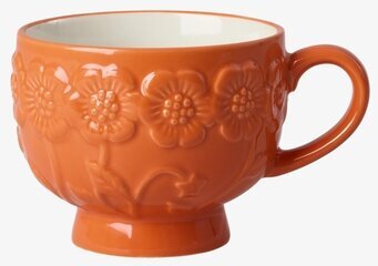 Foto: Orange keramikmugg med relief och blommönster