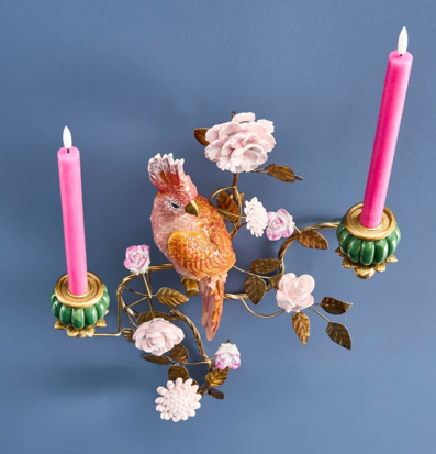 Foto: Väggljusstake med papegoja i orange och guld