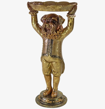 Foto: Hundstaty i guld som håller serveringsfatet