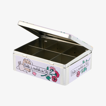 Bild på plåtburk för te med fack och öppet lock