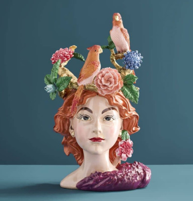Foto: Dekorativ kruka kvinnohuvud med blommor fåglar