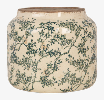 Foto av cremefärgad kruka med grönt blommönster