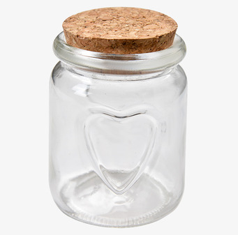 Foto: Glasburk med korklock och hjärtprägling vit bakgrund