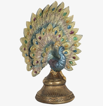 Bild: Dekorativ påfågelfigur med guldfärgad stjärt