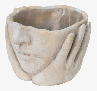 Foto: Skulptural ansiktskruka med händer i relief