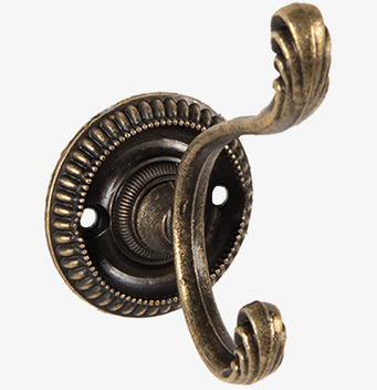 Foto: Väggkrok i antik mässing med dekorativ platta