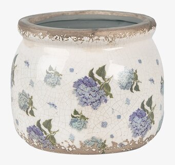 Foto: Rund krackelerad kruka med blå blommor, creme