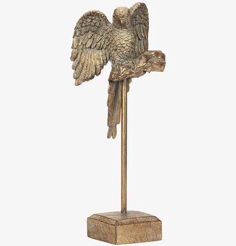 Foto på papegojfigur i metall på fot, vit bakgrund