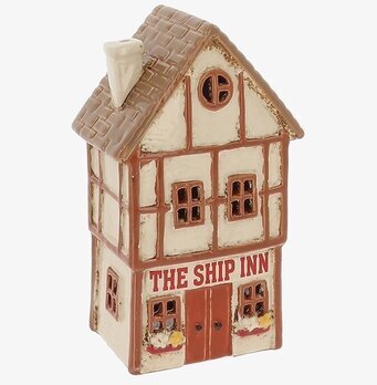 Foto av husformad ljuslykta i tudorstil, vit/brun