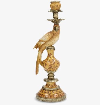 Foto: Saffransgul ljusstake med papegoja, vit bakgrund