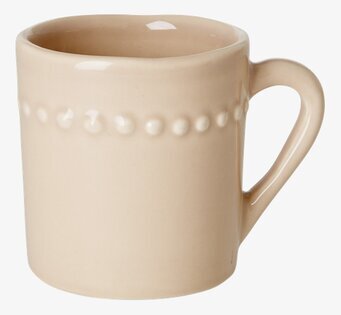 Bild av beige keramikkopp för barn med ergonomiskt handtag