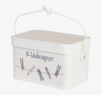 Foto vit plåtburk med lock och handtag, klädnypor motiv