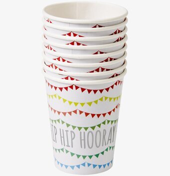 Bild av färgglada pappersmuggar med festliga vimplar