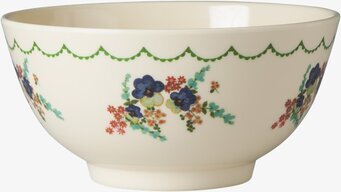 Bild av dekorativ skål med blommönster och grön kant
