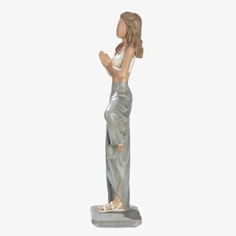 Foto: Yogafigur kvinna i sidoprofil grå vit skulptur