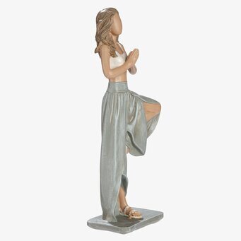 Foto: Yogastaty kvinna i balanspose gråvit skulptur