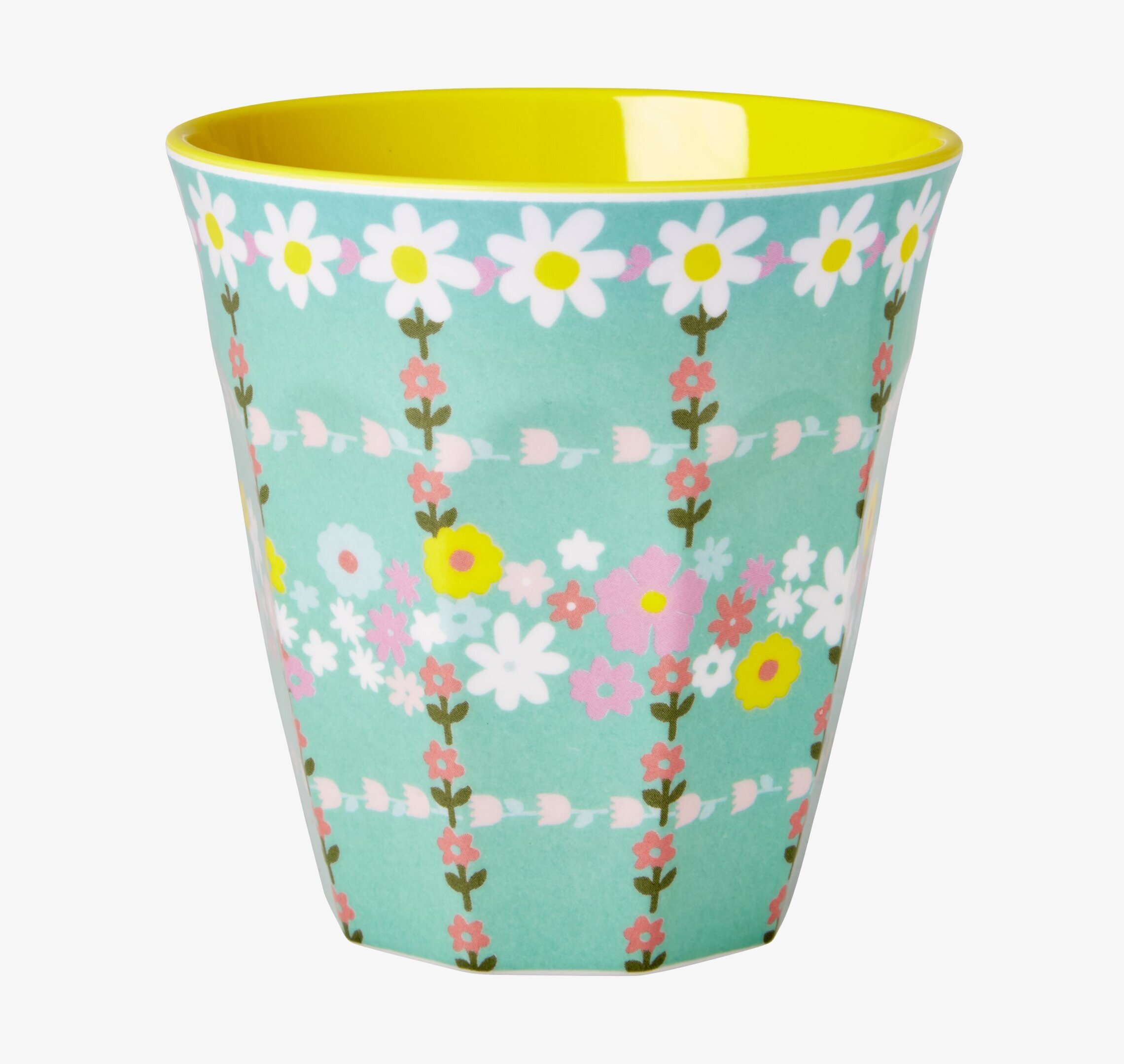 Bild av mugg med retro blommönster och färgglad insida