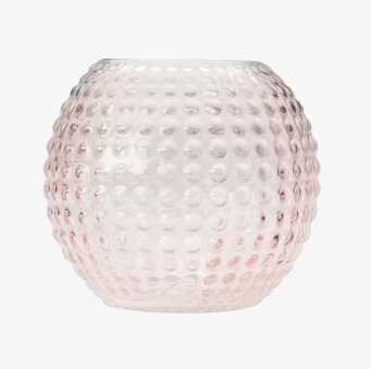 Bild av ljuslykta i rosa glas med bubblig struktur