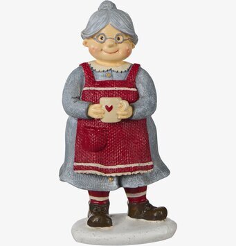 Foto av tomtemor med mugg, förkläde och glasögon