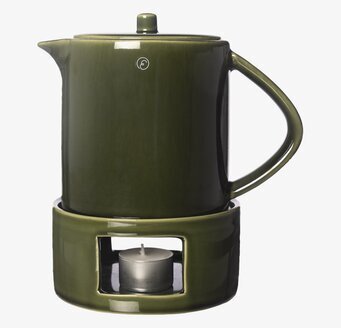 Foto: Grön glöggkanna med värmare på vit bakgrund