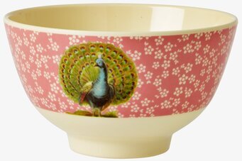 Bild av färgglad skål med påfågel och blommigt mönster