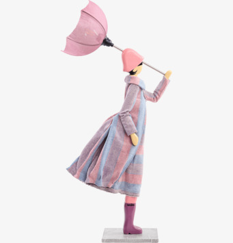 Foto av bordslampa med kvinnofigur och rosa paraply