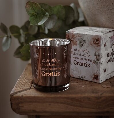 Foto: Ljuslykta i tonat glas med Grattis-text 8cm