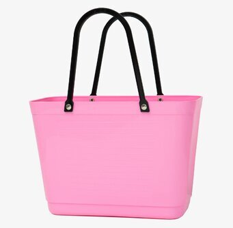 Bild av liten rosa väska med stilren och praktisk design