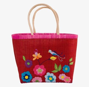 Bild av färgglad handväska med broderade blommor