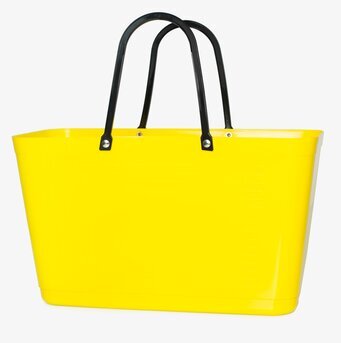 Foto av solgul väska med svarta handtag och rymlig design