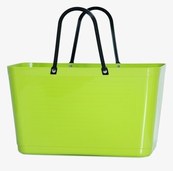 Bild av färgstark limegrön väska med svarta handtag