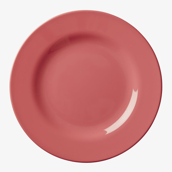 Foto av rund rosa tallrik i elegant och enkel design
