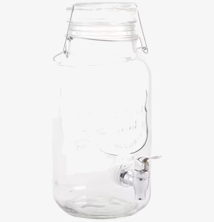 Bild av glasburk med kran och handtag för servering