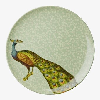 Bild av elegant assiett med påfågel och blommönster