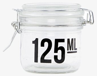 Bild på glasburk med metallklämma och stilren design