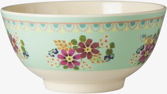 Foto av skål med blommigt mönster och ljusgrön färg