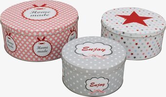 Bild på tre dekorativa plåtburkar med vintagekänsla