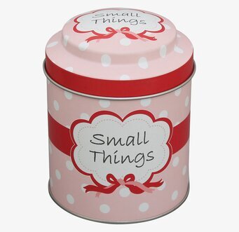 Bild av charmig rosa plåtburk med vita prickar