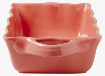 Bild av keramikugn i korallröd med vågiga kanter