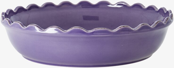 Bild av lila pajform med vågiga kanter och glansig yta