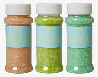 Bild av tre burkar med färgglatt dekorationssocker