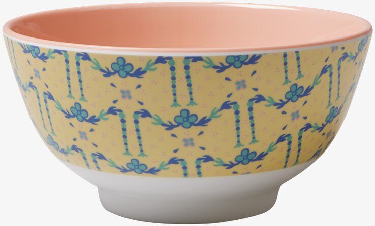 Foto av färgglad skål med blommigt mönster och rosa insida