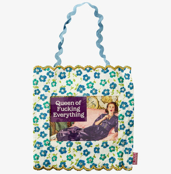 Bild av dekorativt tyg med blommor och inspirerande text